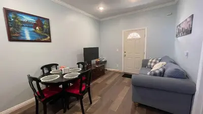 a living room with a table and a couch at Private Sanctuary in Montebello in Montebello