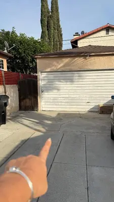 a dog giving a thumbs up in front of a garage at Private Sanctuary in Montebello in Montebello