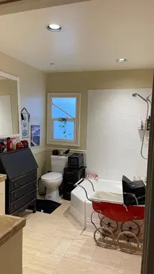 a bathroom with a tub and a toilet and a sink at Private Room View Gated 2Acre Estate - Female Share Indoor - Men Share Outdoor - BB in Engine Company Number 109 Heliport