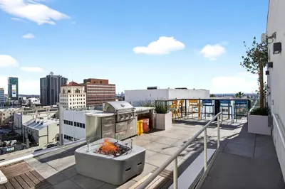 a balcony with a fire pit on top of a building at Modern Hollywood Studio, Pool Parking Gym in Los Angeles