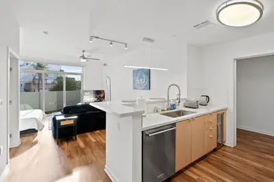 a kitchen with a sink and a counter top at Mid-Wilshire Studio Free Parking, Pool, Gym in Los Angeles
