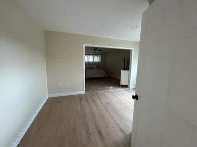 an empty living room with a hard wood floor at Private Hillside Home with View - Yaamava - NOS in San Bernardino