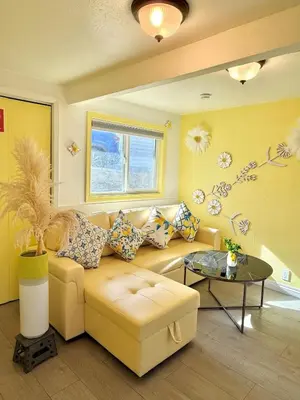 a living room with a couch and a table at Lemon Studio with Mountain view in Rosemead