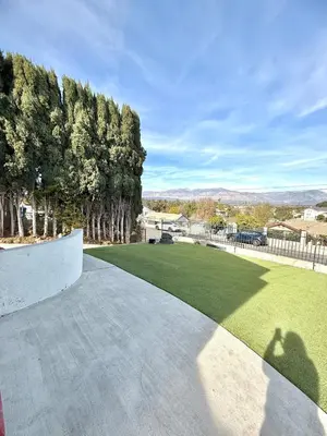 a walkway leading to a yard with trees at Lemon Studio with Mountain view in Rosemead