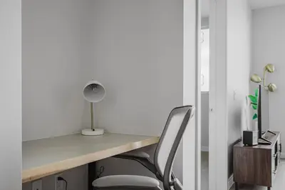 a desk with a lamp and a chair at Blueground Downtown elevator nr parks LAX-1238 in Los Angeles