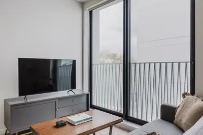 a living room with a tv and a couch at Blueground Downtown elevator nr parks LAX-1240 in Los Angeles