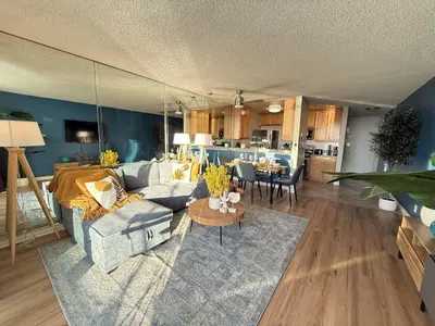 a living room with a couch and a table at Oceanfront 1 BR Oasis w Parking & Pool 107 in Redondo Beach