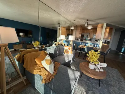 a living room with a couch and a table at Oceanfront 1 BR Oasis w Parking & Pool 107 in Redondo Beach