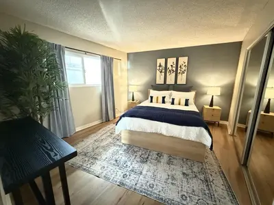 a bedroom with a large bed and a window at Oceanfront 1 BR Oasis w Parking & Pool 107 in Redondo Beach