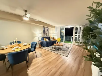 a living room with a table and a couch at Oceanfront 1 BR Oasis w Parking & Pool 417 in Redondo Beach