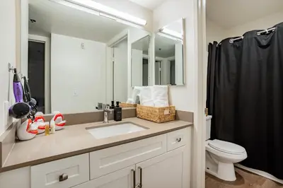 a bathroom with a sink and a toilet at Style, Peace, Comfort in N Hollywood Next to Burbank Free Indoor Parking and Wifi in Burbank