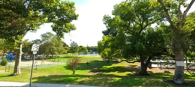 a park with trees and a street sign in the grass at Style, Peace, Comfort in N Hollywood Next to Burbank Free Indoor Parking and Wifi in Burbank
