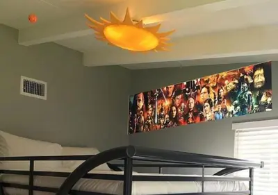 a bedroom with a large tv on the wall at MagicwayVillas Star Wars House - Walking Distance to Disneyland in Anaheim