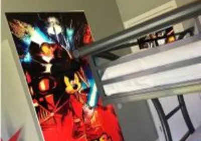 a picture of a superman poster on a bunk bed at MagicwayVillas Star Wars House - Walking Distance to Disneyland in Anaheim