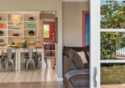 a living room with a couch and a table at MagicwayVillas TeaCup Pool House - Walking Distance to Disneyland in Anaheim