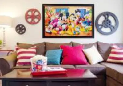 a living room with a couch with colorful pillows at MagicwayVillas Micky's Fireworks Pool & Spa - Across Disneyland in Anaheim