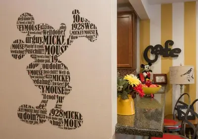 a wall mural of a woman made out of words at MagicwayVillas Mick's ClockHouse Pool & Spa - Walk to Disneyland in Anaheim