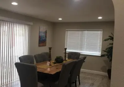 a dining room with a table and chairs at Magicwayvillas Micky's HideAway in Fullerton