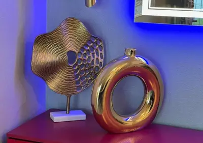 a metal vase sitting on top of a table at MagicwayVillas HeroHouse Pool and Spa in Fullerton