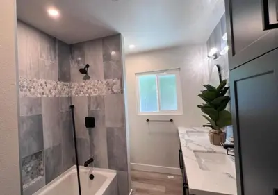 a bathroom with a shower and a sink and a tub at MagicwayVillas Avetar Villa - 5 Bedroom 3 Bath - Spa and Splash Pad in Anaheim
