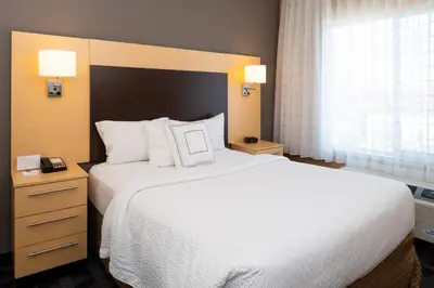 a bedroom with a large white bed and a window at TownePlace Suites by Marriott Bakersfield West in Bakersfield