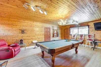 a living room with a pool table and a couch at Wraparound Deck and Grill Wrightwood Cabin Near PCT in Wrightwood