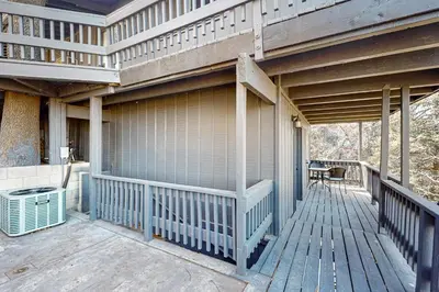 a porch of a house with a wooden deck at Arosa Pines in Crestline