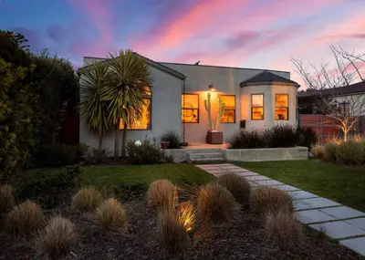 a house with a rainbow in the sky at Sun-Drenched Spanish Manor Home in Mar Vista in Los Angeles