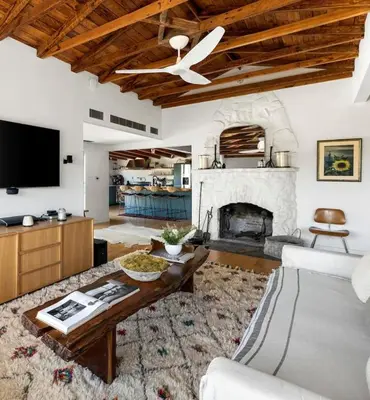 a living room with a couch and a fireplace at Hillside Hideaway with Deck And Spa in Topanga Canyon in Topanga