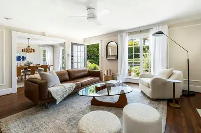 a living room with a couch and chairs and a table at Charming Walk Street Home - A Venice Beach Hideaway in Los Angeles