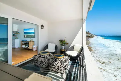 a living room with a view of the ocean at Breathe Malibu Ocean Front Condo with Beach Access in Malibu