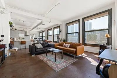 a living room with a couch and a table at Skyline View Loft w Kitchen DTLA Exclusively Month Plus in Los Angeles