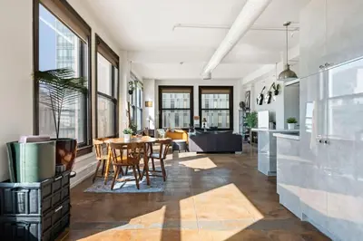 a kitchen and dining room with a table and chairs at Skyline View Loft w Kitchen DTLA Exclusively Month Plus in Los Angeles
