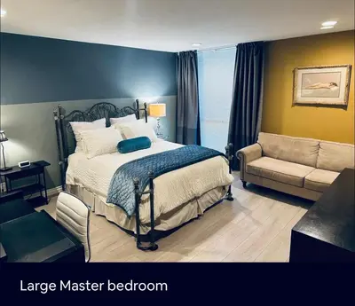 a large master bedroom with a bed and a couch at Best Location West LA Spacious condo with hottub in Los Angeles