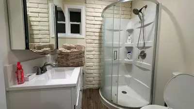 a bathroom with a shower and a toilet and a sink at 2B2B quiet comfy home in Hacienda Heights