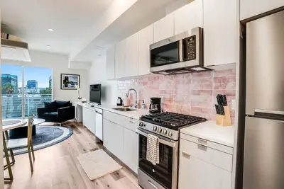 a kitchen with a stove and a microwave at View of Hollywood Sign Studio, Free Parking in Los Angeles