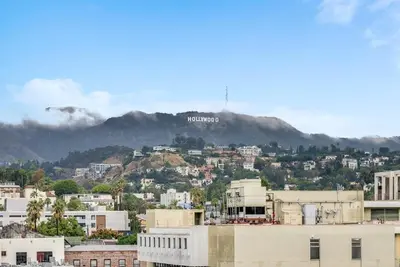 a view of a city with a hollywood sign on a mountain at View of Hollywood Sign Studio, Free Parking in Los Angeles
