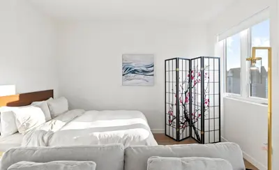 a white bedroom with a bed and a window at Bright Studio on Sunset Blvd, Free Parking, Gym, and Pool in Los Angeles