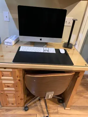 a desk with a computer monitor and a keyboard and mouse at TimberWood Cabin- 3 Bdr - 2 Bth - Big Game room - Prime Location in Big Bear Lake in Big Bear Lake