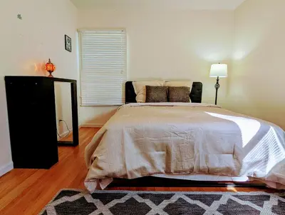 a bedroom with a large bed and a window at Entire House,Convinient location in Los Angeles , near Universal, Hollywood, Pets Friendly, Free WIFI in Sherman Oaks Community Hospital Heliport