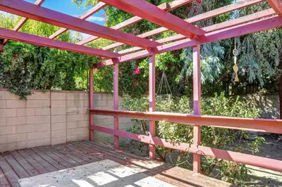 a wooden pergola with a fence and trees at Entire House,Convinient location in Los Angeles , near Universal, Hollywood, Pets Friendly, Free WIFI in Sherman Oaks Community Hospital Heliport