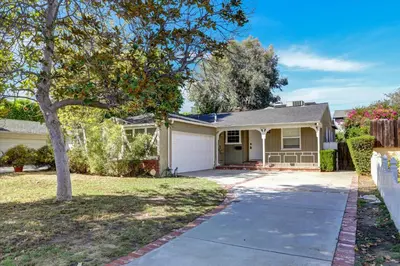 a house with a tree and a driveway at Entire House,Convinient location in Los Angeles , near Universal, Hollywood, Pets Friendly, Free WIFI in Sherman Oaks Community Hospital Heliport