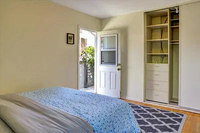 a bedroom with a bed and an open door at Entire House,Convinient location in Los Angeles , near Universal, Hollywood, Pets Friendly, Free WIFI in Sherman Oaks Community Hospital Heliport