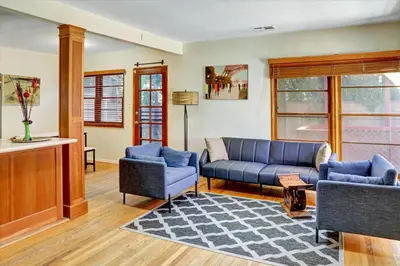 a living room with a blue couch and chairs at Entire House,Convinient location in Los Angeles , near Universal, Hollywood, Pets Friendly, Free WIFI in Sherman Oaks Community Hospital Heliport