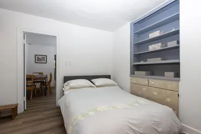 a bedroom with a bed and a dining room at Walk to Melrose Ave - World Famous Shops and Restaurants in Los Angeles
