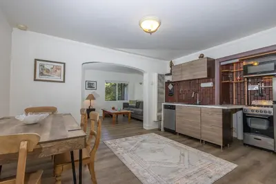 a kitchen and living room with a table and a dining room at Walk to Melrose Ave - World Famous Shops and Restaurants in Los Angeles