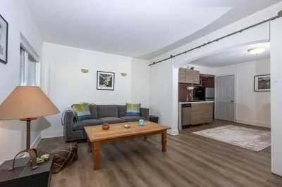 a living room with a couch and a table at Walk to Melrose Ave - World Famous Shops and Restaurants in Los Angeles