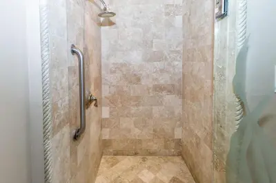 a bathroom with a shower with a glass door at Spacious 2BR with Kitchenette and Dining in Beverly Hills in Los Angeles