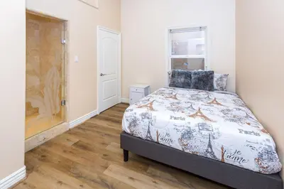 a bedroom with a bed and a window at Spacious 2BR with Kitchenette and Dining in Beverly Hills in Los Angeles