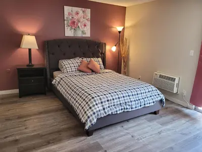 a bedroom with a bed with two pillows on it at Beverly Hills Suite in Los Angeles
